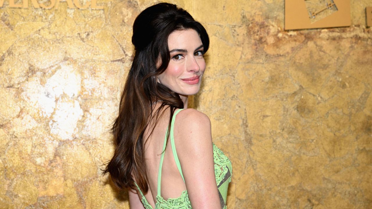 Anne Hathaway's Earthy Green Living Room Corner Perfects the Swiss Chalet Aesthetic – It's the Most Transportive Way to Design in 2026