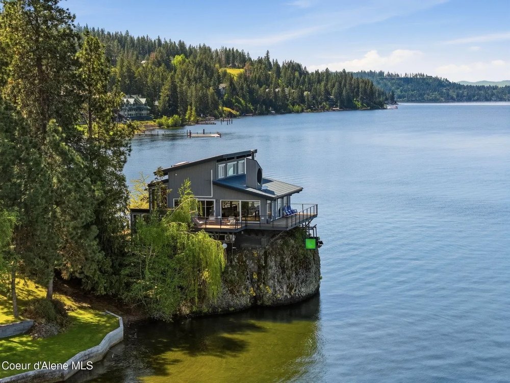 Glass-Walled House Perched on a Giant Lakeside Rock Makes It Feel Like You're 'Living in the Water'